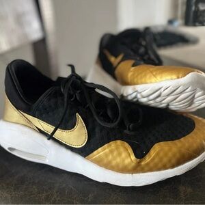 Women’s black and gold Nike - Size 9.5